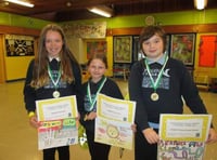 Pupils take part in a drawing competition to promote road safety