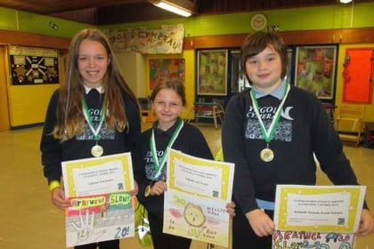 Pupils take part in a drawing competition to promote road safety