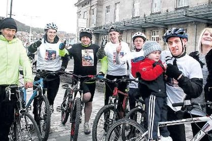 Cyclists arrive in Aber after gruelling charity ride