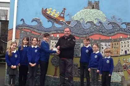 Schoolchildren present cheque to local lifeboat crew