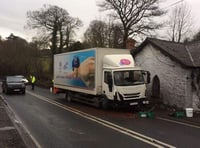 Road closed after crash between car and lorry