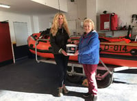 Bride hands wedding donations to RNLI