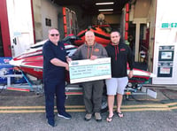 Jet skiers hand out charity cheques