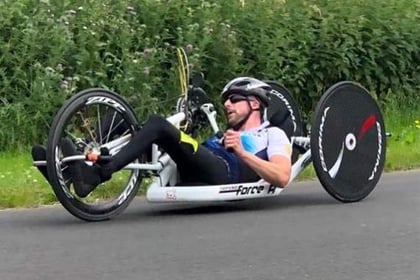 Triathlete who survived crash takes on 100-mile charity handbike ride