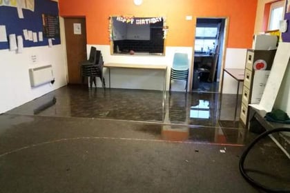 Scouts call for help after storm waters flood hall