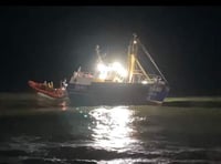 Fishing vessel runs aground at harbour mouth