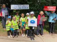 Claps and cheers for 'save our school' march