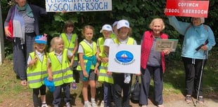 Claps and cheers for 'save our school' march