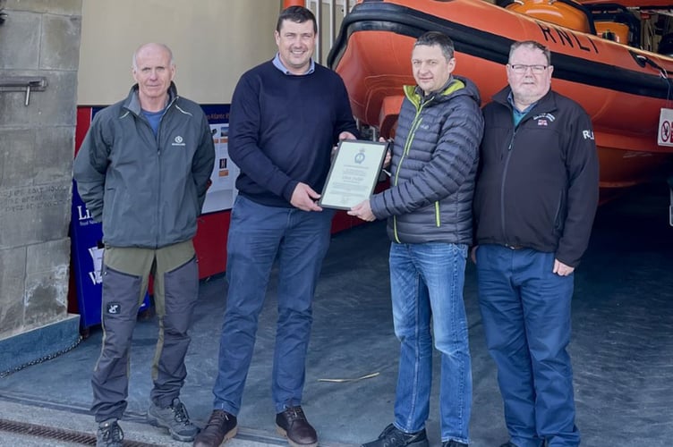 Pictured from left to right are: Lifeboat operations manager, Clive Moore, Area lifesaving manager, Andy Dodd, former lifeboat operations manager, Chris Fisher and chairman Peter Williams