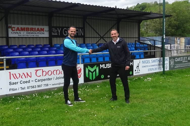 Barry Evans, Penrhyndeudraeth FC committee member, and Steve Ellison, National Grid senior project manager for the Snowdonia Visual Impact Provision project