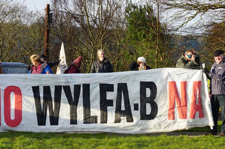 People Against Wylfa B protesters pictured campaigning by the suspension bridge at Menai Bridge