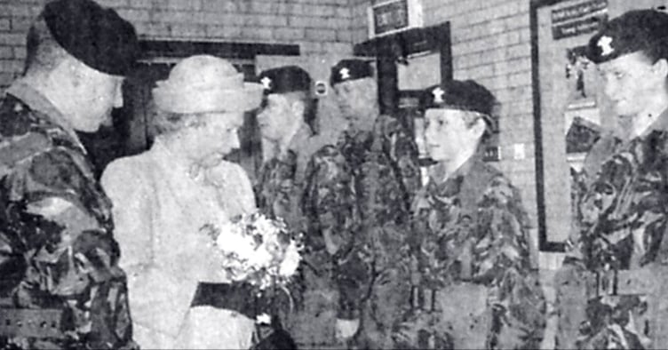 Second Lieutenant Andrew Davies introduces the Queen to Dyfed cadets at her unveiling of a plaque at the Aberystwyth Territorial Army Centre