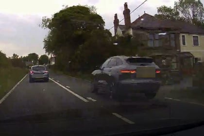 Jaguar driver overtakes three cars approaching a blind bend on A487