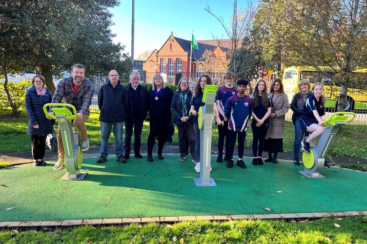 Cllr Clive Davies and pupils from Cardigan Secondary School demonstrate how to generate power from bikes at the launch of the “On your Bike” project in Cardigan