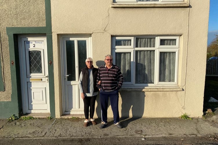 Paul and Susan Minns outside their home of 15 years. 