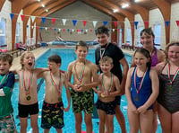 Young swimmers raise funds for pool and friend with rare condition