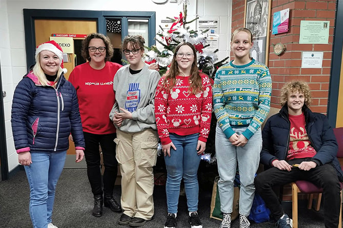 Angharad Evans and Elin Mabbutt, who organised the event, with their children