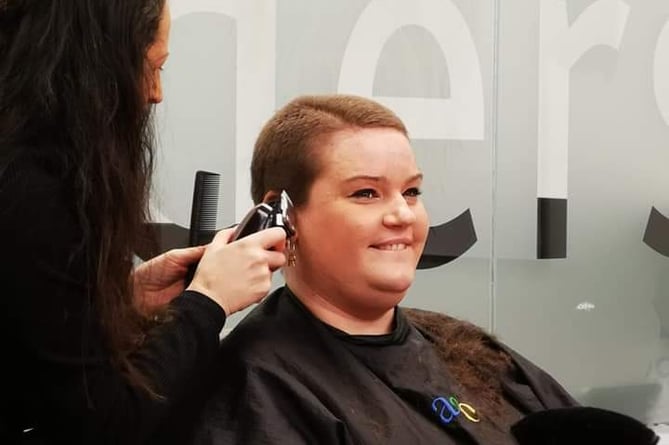 Rachel Davies being shaved by Jacquie McCartney of Jago Hair Salon, Aberystwyth.