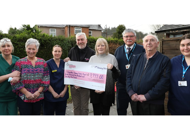 Pictured at the garden are (from left) Health Care Assistants Sharon Brown and Tracey Spooner, Junior Sister Sara Williams, Guy Jones of the National Lottery Community Fund, former Senior Sister Christine Bryant, Business Manager (North) Tony Goodman, Nye Jones of the League of Friends and Senior Sister Ellie Jolley-Dawson.