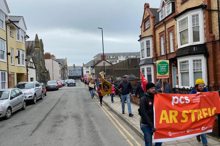 The line of striking workers was as long as the street