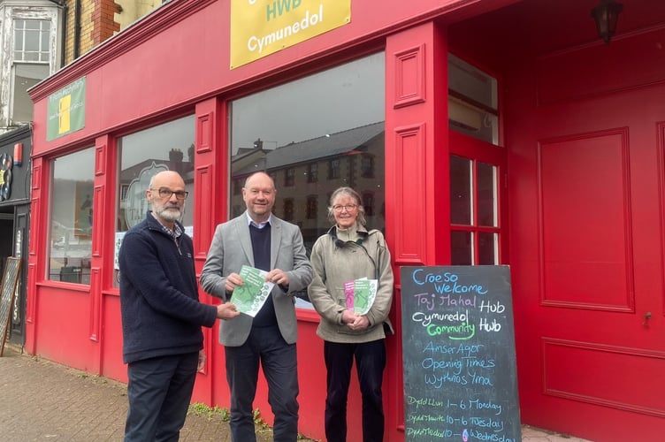 Andy Rowland (Ecodyfi), Cefin Campbell MS and Ann MacGarry outside the Community Hub at the Taj Mahal, Machynlleth 