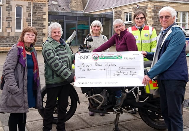 Carol singers raise £1,100 for good causes