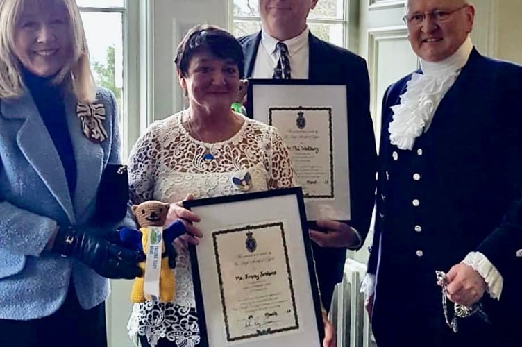 Jenny and Phil receiving their awards