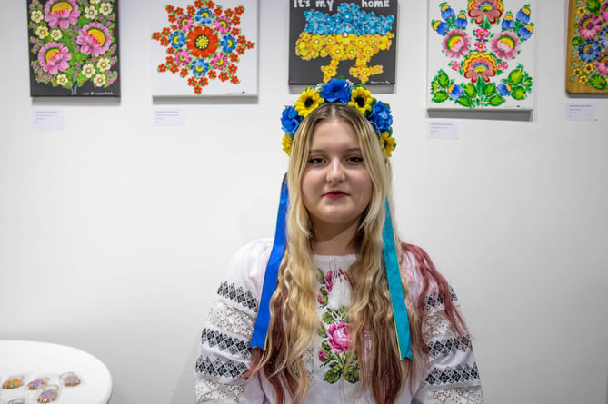 Darya with her paintings