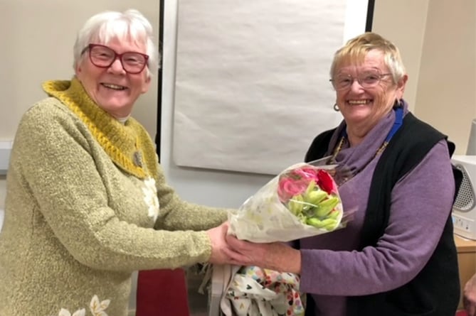 Tywyn Inner Wheel president Chris was presented with some flowers for her birthday by Marilyn
