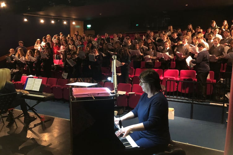 The Music Service choir in rehearsals for the concert