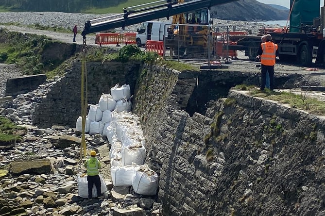 Council workers installing sand bags