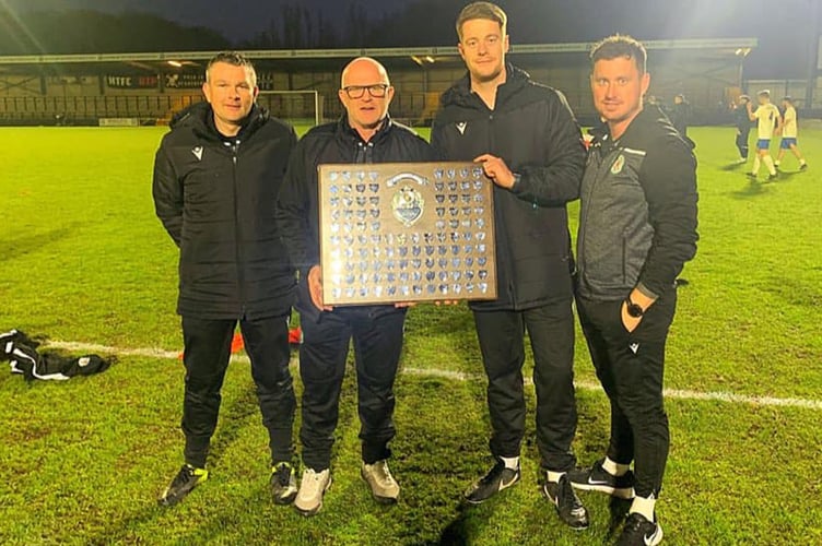 Marc Lloyd Williams and his coaching staff with the shield