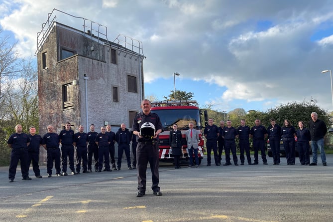 Mike Evans is pictured with colleagues outside Pwllheli Fire Station