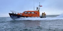 RNLI rescue three people and a dog