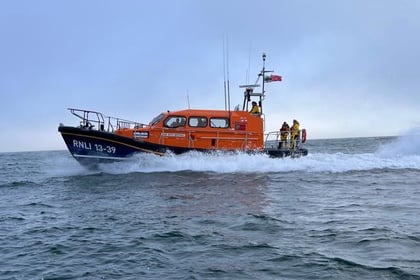 RNLI rescue three people and a dog