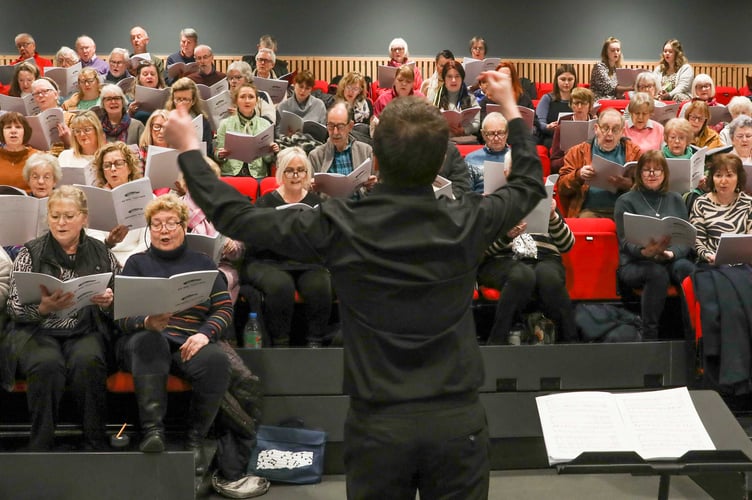 NEW Voices community ensemble rehearses at Ty Pawb, Wrexham, in readiness for their We Rise Together concert celebrating cultural diversity at St Giles Church, Wrexham on April 1. Conductor Rob Guy will be assisted by Ukrainian refugee Polina Horelova, now living in Wrexham after escaping the Russian onslaught of her homeland. She will conduct two Ukrainian songs.
Rob Guy conducting