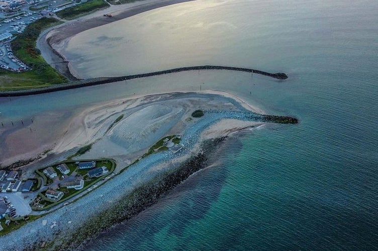 This drone photo reveals a harbour that looks like - a dolphin. Photographer Rhys Jones was amazed to see the likeness in an aerial picture he took over Pwllheli in Wales.See SWNS story SWLNdolphin.  Rhys has taken his drone over the marina many times but this was the first time he noticed the aquatic appearance of the landscape. The 37-year-old, who has been taking drone photos as a hobby for the past two years, said: "Once seen it it cannot be unseen. "In all my flight time over over the Pwllheli harbour I have never noticed this as much as last night, spectacular!"
