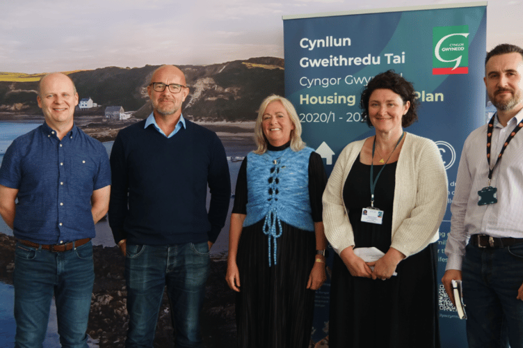 Gwynedd Council Chief Executive, Dafydd Gibbard; Cabinet Member for Housing and Property, Cllr Craig ab Iago; MP Liz Saville Roberts; Head of Housing and Property Department Carys Fôn Williams and Gareth Moriarty Owens from the council’s Housing Department took part in the launch on Monday on the council’s stand at the National Eisteddfod