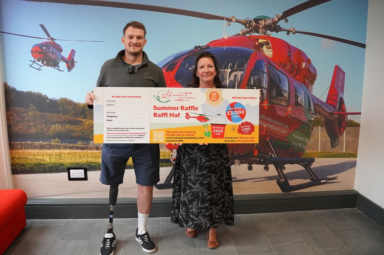          Richard Jones, another past patient who drew the raffle, with Phae Jones from the Wales Air Ambulance                      