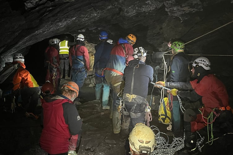 North Wales Cave Rescue Organisation members prepare to haul stranded person up the underground pitch