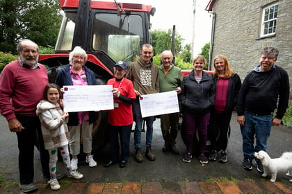 Tractor run organisers donate £750 to charities