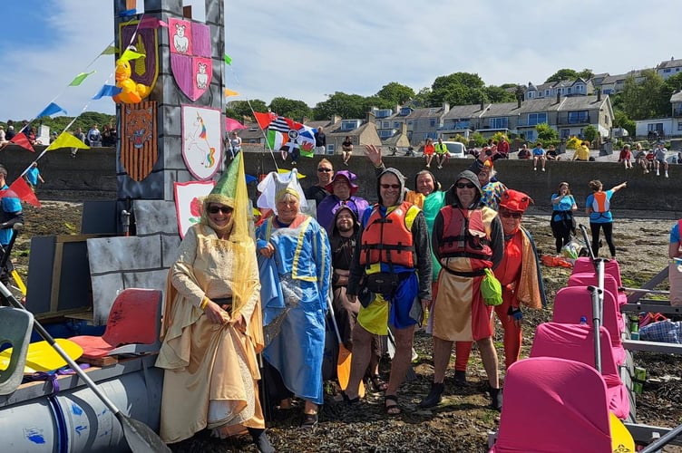 Members of the Starlight Players are pictured on the beach with their award-winning raft