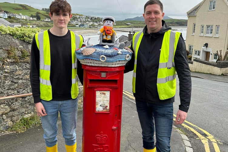 Iago and Ifer Gwyn, members of Criccieth's RNLI Rescue Team, pose with Brian