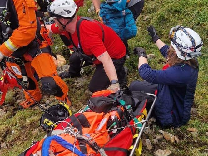 The team attend to a walker who fell over 40ft