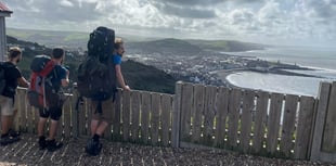 Folk duo hit halfway point of coast path walk in Ceredigion