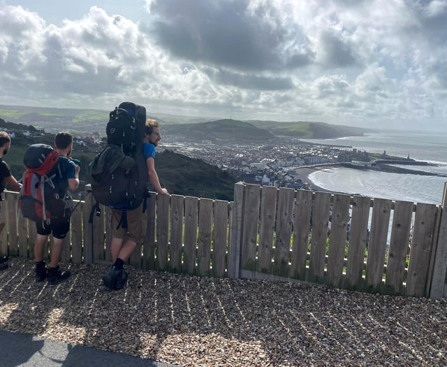 Folk duo hit halfway point of coast path walk in Ceredigion