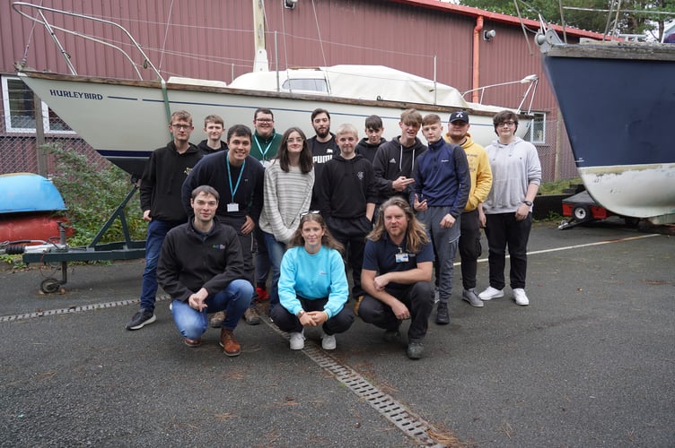 Lois, front centre, is pictured with the students