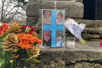 Road remains closed as tributes pour in for four teens