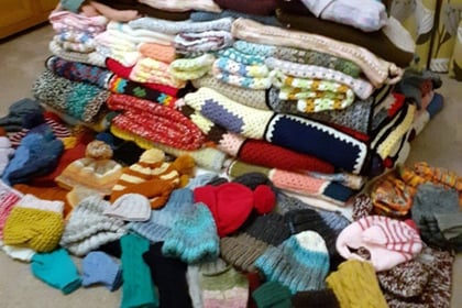 WI's Catty Crafters knit 125 winter warmers for those in need