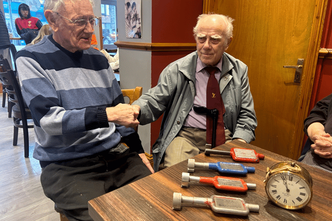 The last station master of Bala, John Hurst (left) meets up with John (Bach) signalman who joined the Great Western Railway in 1947. They were reunited in Bala earlier this month. Both brought along mementos of the railway; the clock from Bala signal box, and single line tokens from Bala Town, Bala Junction, Llanuwchllyn and Drws-y-nant
